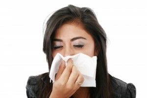 Girl sneezing/freedigitalphotos