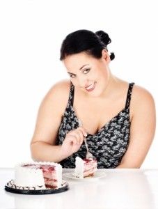 Woman eating cake/freedigitalphotos