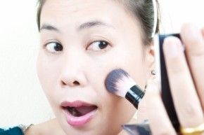 Woman doing makeup