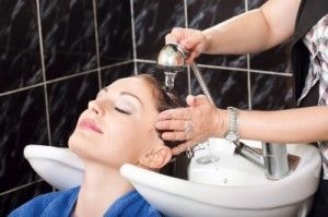 Lady getting a head wash after hair colour/