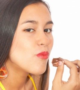 A girl having a chocolate/freedigitalphotos