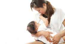 A woman breastfeeding/freedigitalphotos