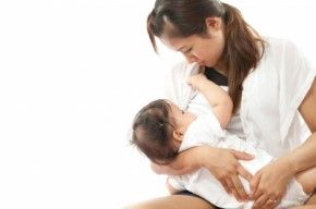 A woman breastfeeding/freedigitalphotos