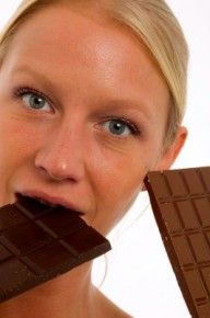 Lady eating chocolates/freedigitalphotos