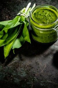 Jar of fresh home made pesto made with herbs 