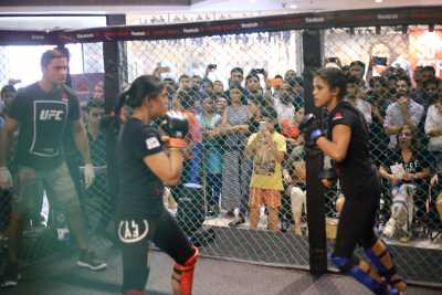 Women fighters battle it out in the MMA cage at Reebok Fight Night