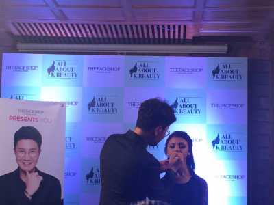 Makeup Artist Shawn giving a makeover to an Indian model with TheFaceShop products