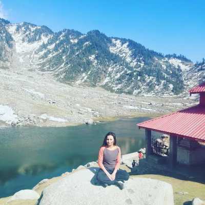 Rachna posing in front of Kareri Lake