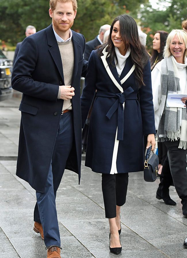 Meghan wore a long black blazer with white shirt and black pants