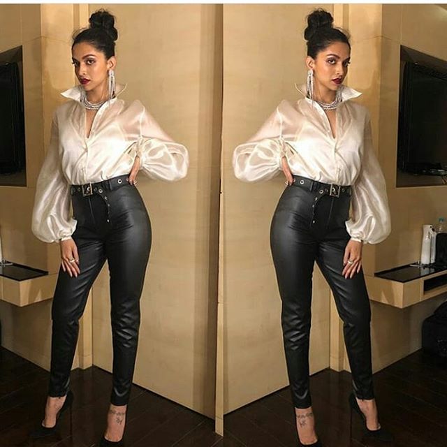 Deepika slaying skin hugging cigarette trousers and with a white silk shirt