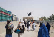People cross Friendship Gate at Pakistan-Afghanistan border town of Chaman